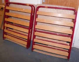 Two metal framed wooden slatted camp beds.