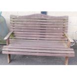 A wooden slatted garden bench.