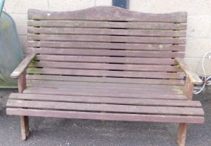 A wooden slatted garden bench.