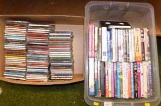 A large selection of DVDs and CDs, titles include The King's Speech, Dinner Ladies, etc. (2 boxes)