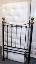 A black and gilt framed brass metal framed single bed, with divan base and mattress.