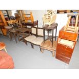 An old wooden filing cabinet with four drawers, small stool, other occasional furniture including a