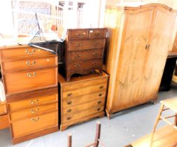 A two door wardrobe with no key, chest of drawers, small chest of drawers, bachelor's chest and an o