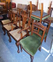 A set of six George III style dining chairs, each with mahogany ball and claw feet and drop in seats