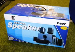 A multi media speaker system, boxed.