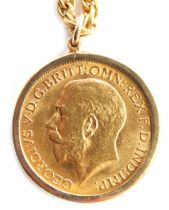 A George V gold sovereign 1913, in sprung pendant mount and yellow metal rope twist necklace marked