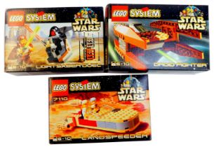 Three Star Wars Lego System sets, comprising Droid Fighter, 7111, Lightsabre Duel, 7101, and Land Sp