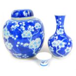 A Chinese blue and white ginger jar, hand painted with prunus blossom decoration in under glaze blue
