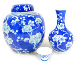 A Chinese blue and white ginger jar, hand painted with prunus blossom decoration in under glaze blue