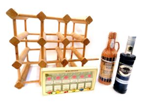 A bottle of Creme Cassis, together with a bottle of Madeira Wine, in original packaging with basket