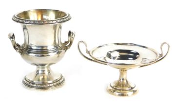 An Elizabeth II silver two handled urn, with a leaf decorated border, on circular foot, Birmingham 1