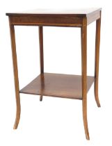 An Edwardian mahogany two tier occasional table, the square top with inlaid decoration, raised on sl