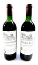 Two bottles of Chateau du Rocher Saint-Emilion Grand Cru 1982.