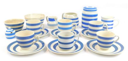 A group of Cornish ware type blue and white banded pottery, to include mugs, milk jug, jar and cover