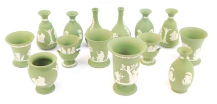 A group of green Wedgwood jasperware vases, to include bottle shaped, 13.5cm high, cylindrical vase