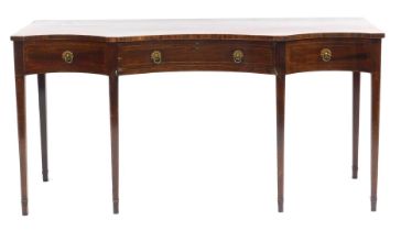 A George III inverted serpentine serving table, with boxwood line inlay, having a central curve draw