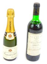 A bottle of La Cour Pavillon Bordeaux 1978 wine, and a bottle of Marguerite Christel dry champagne,