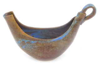 A Mick Morgan studio pottery sauce boat, South Wales Pottery, of Roman boat form, decorated with a b