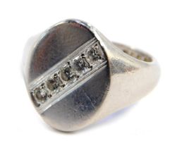 A platinum gentleman's signet ring, with oval plate set with five small diamonds, size O, 14g all