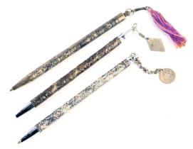 Three Israel ballpoint pens, each with embossed decoration in white metal depicting floral motifs, M