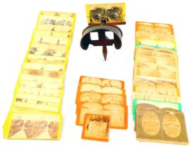 An early 20thC stereoscopic viewer, together with various slides, to include floral studies, Tewkesb