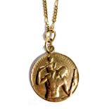 A 9ct gold St Christopher pendant, on a fine figaro chain, 9.6g.