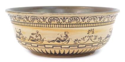 A Danish Rogild pottery bowl, with brown glaze interior, the exterior with incised decoration depict