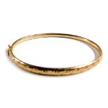 A 9ct gold child's hinged bangle, 5.2g.