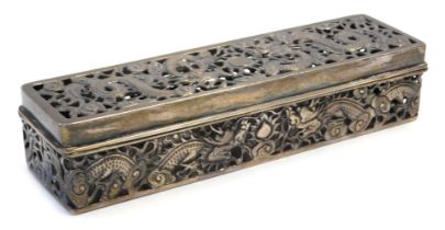 A Chinese white metal dressing table box, of rectangular form with pierced decoration depicting drag