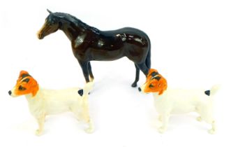 A Beswick pottery model of a brown horse, printed marks, 22cm high (AF), together with two Beswick J