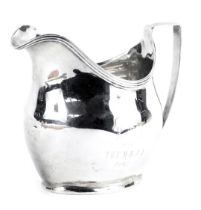 A George III silver cream jug, with a raised reeded rim, London 1805, 3.24oz, 9.5cm high.