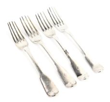 A set of four George IV silver fiddle pattern table forks, initial engraved, London 1823 and 1826, 8