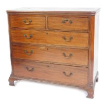 A George III mahogany chest, of two short over three long graduated drawers, raised on ogee bracket