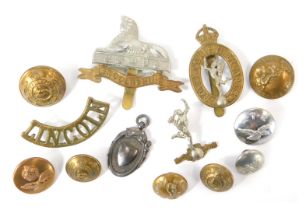 A group of Lincolnshire Regiment cap badges and buttons, Royal Corps of Signals cap badge and button