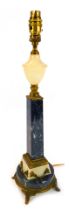 A 20thC black marble onyx and cast metal table lamp, the onyx urn shaped top above a tapering square