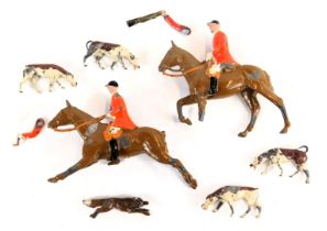 Two mid century Britains lead figures of huntsman on horseback, together with four hounds and a fox,
