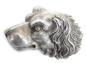 A brooch in the form of a dog's head, white metal, 4cm.