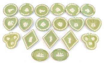 A group of green Wedgwood jasperware trinket dishes, varying shapes, to include circular, 11cm diame