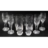 A group of Eugen Montelin Swedish moulded glass, comprising two tankards, four champagne flutes and