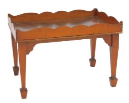 A mahogany tray top occasional table, raised on tapering square legs and spade feet, 37cm high, 55cm
