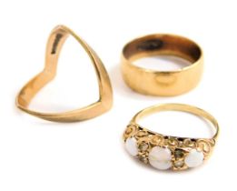 Three 9ct gold rings, comprising a plain broad band, plain chevron ring, and an opal set three stone