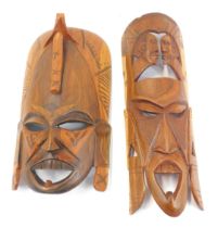 Two African carved hardwood masks, 47cm high and 41cm high.