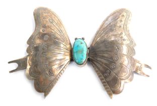 A white metal and turquoise butterfly brooch, designed as an exotic butterfly with cabochon turquois
