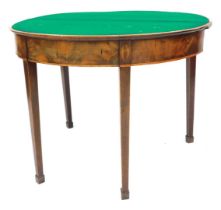 A George III mahogany demi lune card table, with rosewood cross banding, opening to reveal a baize i