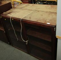 Two simulated rosewood wall mounted cabinets, each with a glazed door enclosing three shelves, 99cm