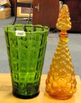 A moulded green glass vase, of tapering cylindrical form, 30cm high, together with an amber coloured