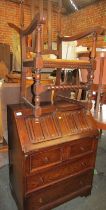 An oak bureau, together with an oak open armchair.