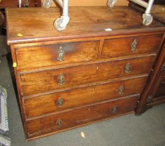 A George III oak chest of drawers, the top with a moulded edge with two short and three long drawers