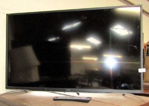 A Sharp Aquos 40" television, LC-40F635K, with lead and remote.