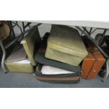 Two cases containing linen, some worked, etc., together with a further mid century brown leather cas